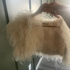 Ivy and aster white ostrich feather shrug from Bhldn(Anthropologie bridal line).
